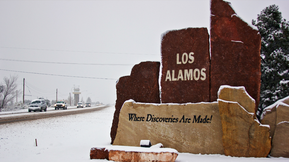 Los Alamos "Where Discoveries Are Made" on the side of a road.