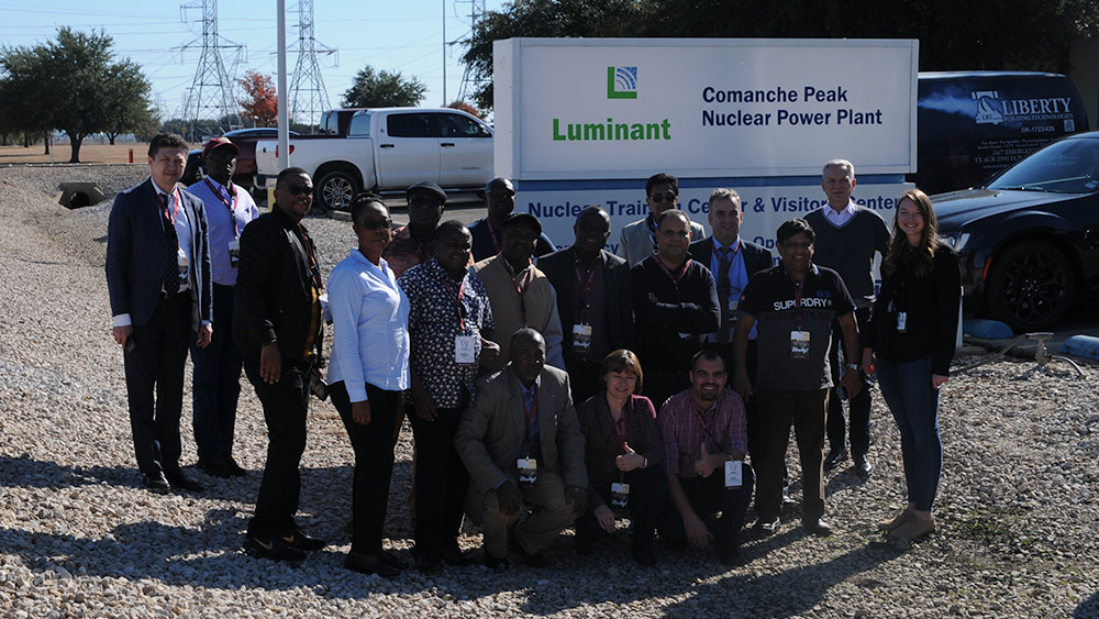 Group of people standing in parking lot at Comanche Peark Power Plant